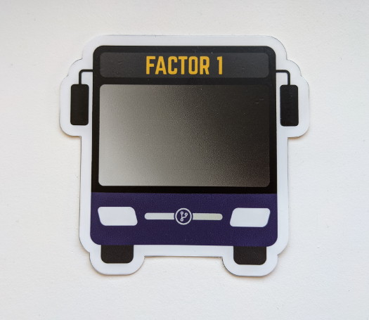 A bus-shaped sticker with the text 'Factor 1' near the top, and a dark purple accent color